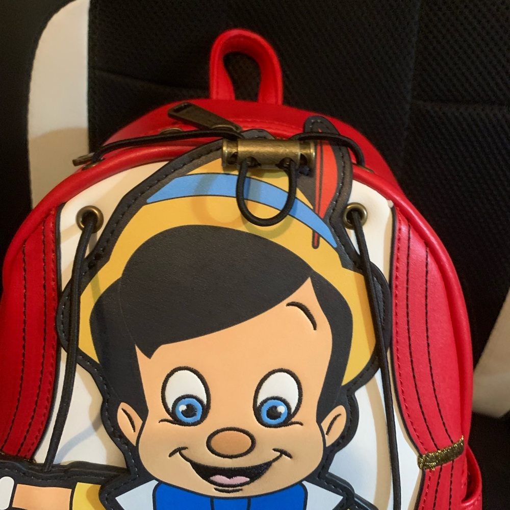 Pinocchio loungefly backpack with moving arms and matching loungefly wallet - Picture 3 of 16